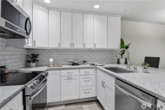Custom cabinets & extensive recessed lighting.
