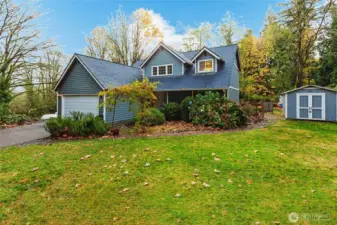 Lush greenery frames the home.