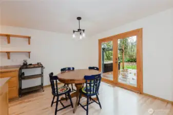 French doors off the dining area open to the deck and backyard.