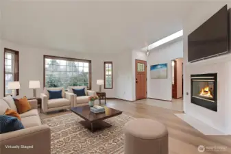 As you enter the home, you will find a massive family room with double-side gas fireplace, and beautiful skylight and large windows letting in all the light! ***Virtually Staged***