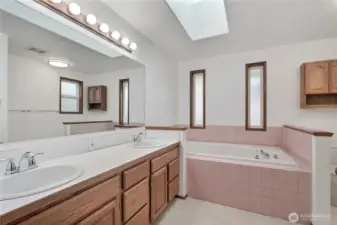 Primary Suite bath, true 5-piece with double vanity, soaking tub and separate shower. Cathedral ceilings and skylight, an oasis!