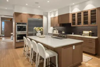 Gourmet kitchen loaded with storage, Quartz countertops, Massive walk in pantry and temperature controlled wine room.