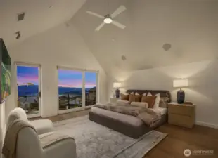 Primary Suite on the upper level with deck space, cathedral ceilings and glorious views.