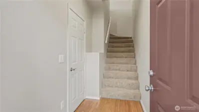 Home enters into the ground floor, garage to the left and living and bedrooms upstairs.