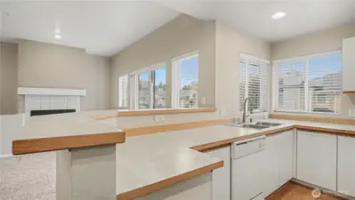 A beautifully lit space with charming windows above the sink, offering natural light and a perfect view while you cook or clean.