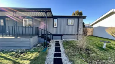 Back entrance leading to covered veranda or back yard