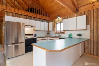 Kitchen with bar seating.