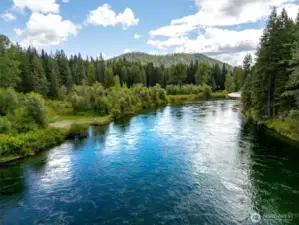 Private access to the Wenatchee River is just 1 block away from the home. Beach is shown to the left.