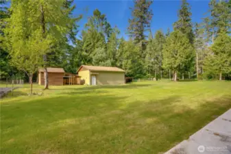 Expansive lawn and detached shop/garage offer room to roam, tinker, or store your tools and toys—just off the greenbelt for extra privacy.