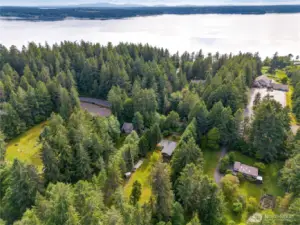 Located just across the Fox Island Bridge, this lush, secluded property combines convenience with serene PNW beauty—minutes from the water, a world away from the rush.