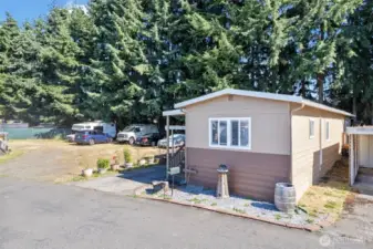 Sits like a corner lot. New exterior paint and a 1 car carport & storage with covered patio