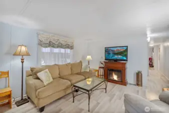 Living room has updated flooring and paint