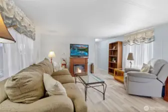 Hall way leads down to laundry, 2 bedrooms, full bath and another exterior door