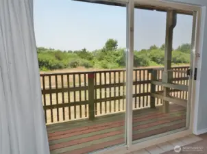View through the Slider out to the private Deck.  Faces West.