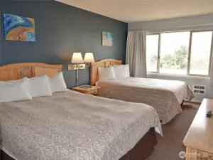 Spacious Bedroom w/ 2 Queen-sized beds.