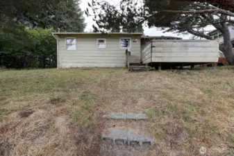 Westside 2 bedroom cabin with property to the Western Upland Boundary. Just a short walk to the beach