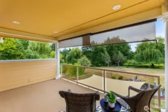 Private covered balcony off primary bedroom