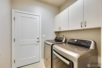 Laundry room with upper cabinets for extra storage