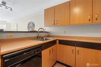 Prep meals while staying connected—open kitchen layout keeps you part of the conversation