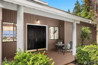 A covered front porch and elegant double doors create a gracious first impression—an inviting welcome for family and guests alike. Don’t miss your first glimpse of the breathtaking views through the window to the left.