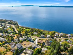 This stunning aerial shot highlights the home’s exceptional location just moments from the water, offering a rare blend of neighborhood charm and coastal scenery. Don't miss the short walk to Kayu Kayu Park.