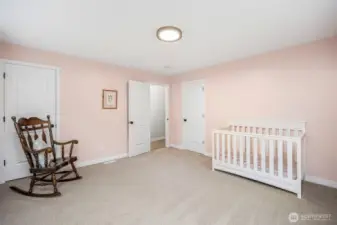 Bedroom has two large closets & lots of light from two larage windows