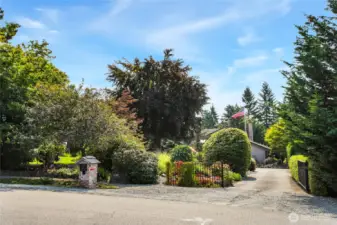 Gated front entry for added privacy. Off-street parking on either side of mailbox.