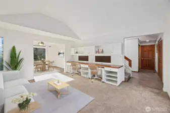 Separate dining area and living room with two dedicated workspaces. Image is virtually staged for visualization purposes.