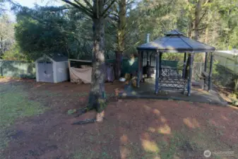 Wood burning stove is sure to keep you toasty on cool beach evenings!  Firewood storage as well as tool shed are adjacent to the gazebo.