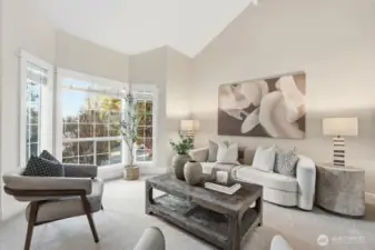 Bay windows and fresh carpeting in main living space