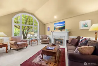 Living room with large light-filled window.
