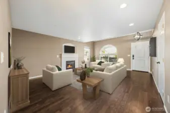 Natural light shines across Pergo Wetprotect luxury laminate throughout the main floor. (virtually staged)