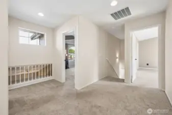 Upstairs features convenient laundry room, guest bathroom, and spacious bedrooms.