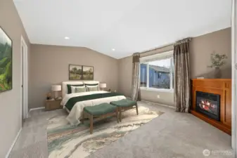 The primary features a third fireplace and remodeled ensuite with jetted tub.(virtually staged)