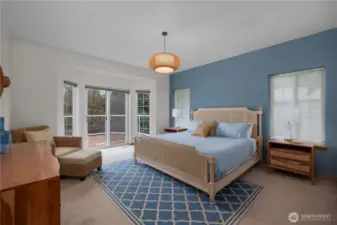 Primary suite - doors lead you to the deck.  Come and be home here!