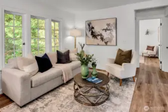 Cozy living room overlooks the evergreens and Thornton Creek.