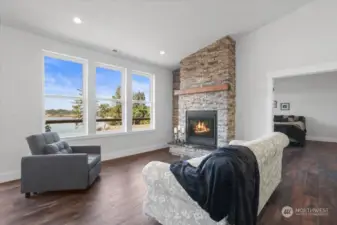 Spacious living room with cozy gas fireplace.