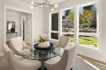 Picture yourself hosting unforgettable gatherings in this elegant Formal Dining Room, offering a sophisticated view of the entrance and the charming front street. Perfect for making a lasting impression on your guests, this space sets the stage for any occasion.