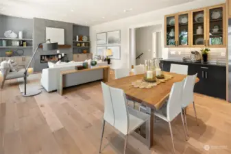 Another view from the kitchen to the dining area and great room. Featuring the beverage station with built in display shelves above.