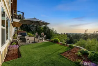 This inviting patio seating area is the perfect spot to relax and enjoy peaceful views of the islands, gardens, and surrounding landscape.