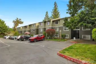 Unit A-305 has one dedicated parking space right in front of the building and stairs to unit