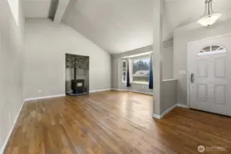 Original hardwood floors and vaulted ceilings