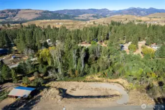 Developed building site overlooking a shimmering aspen grove.