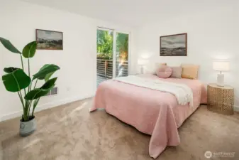Second bedroom with slider to the back deck for slipping into the hot tub before bed.