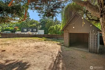 Backyard is big -- great for games or gardens. Generous torage shed has concrete floor; great shop or studio space.