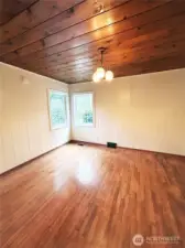 Oak hardwood floors and garden views from main floor bedroom