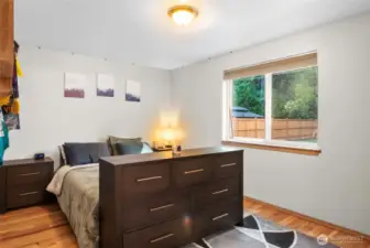 Primary bedroom has a private view of the backyard.