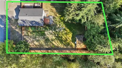 Property extends a bit beyond the back fence.  Also notice walking trail along the fence at the bottom of the photo.  This is part of 50 acres of trails throughout the neighborhood.