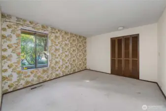 Bedroom 2, located near the front entrance.
