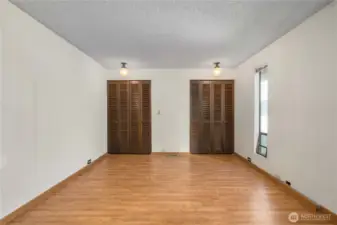Primary suite includes wall of closets and full bathroom.